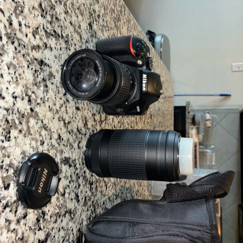 Nikon Black Digital Camera with Ergonomic Design and Professional Lens